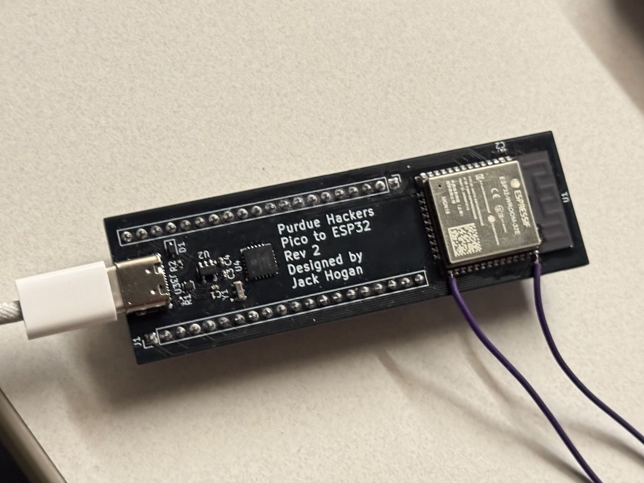 A small, black, gum stick-sized PCB that controls the Sign with an ESP32.